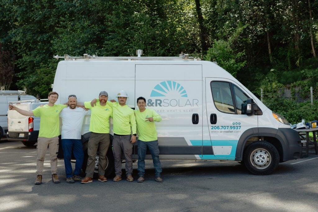 A&R Solar crew smiling after a successful installation.