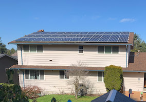 Picture of a white home with solar panels installed by A&R solar.