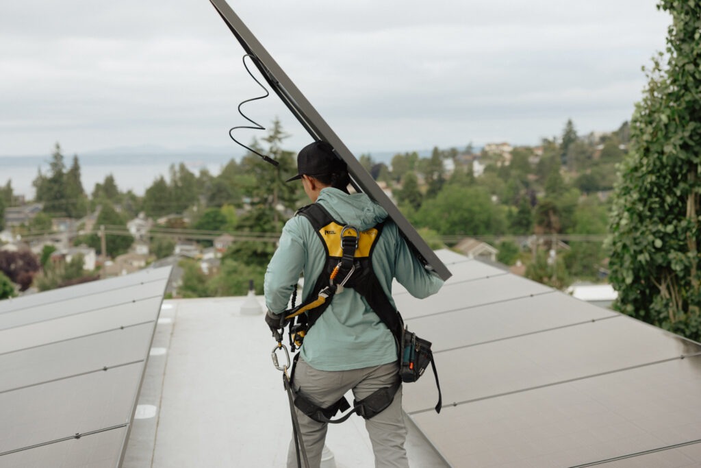 Man carrying solar panel